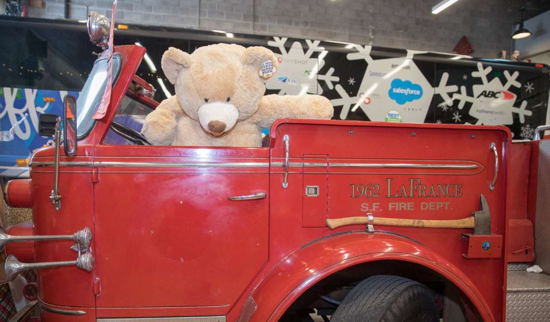 WeDriveU Stuff the Bus donation delivery at SF Firefighters Toy Headquarters 2019