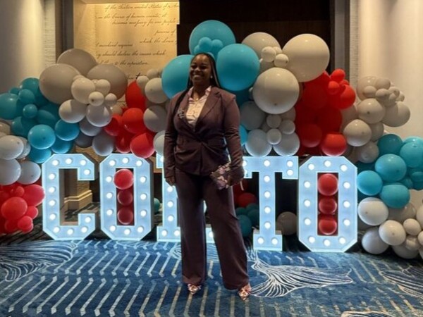 WeDriveU Keyshana Jackson at COMTO sign